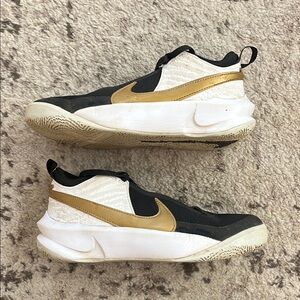 Nike Black and Gold Sneakers with Mid-Top Design